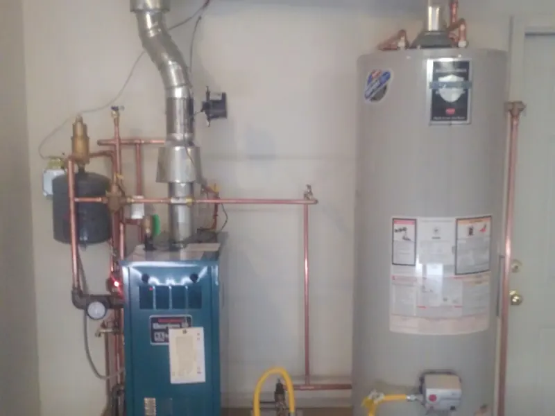 New Burnham boiler and Bradford White power-vent water heater by Rapid City Plumbing