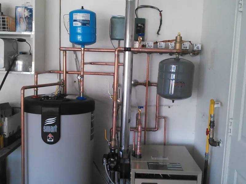 A new Weil-McLain boiler and ACV Smart indirect water heater installed by Rapid City Plumbing in a Rapid City home