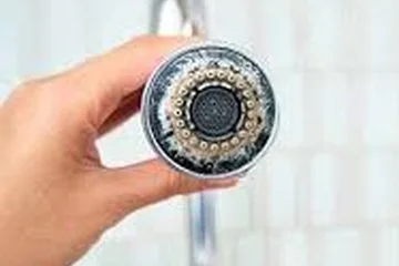 Shower head with hard-water scale