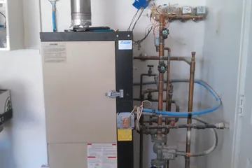 Old combination water heater before replacement