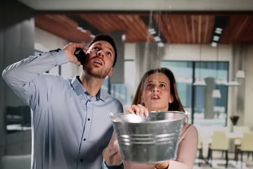 Homeowner calling a plumber